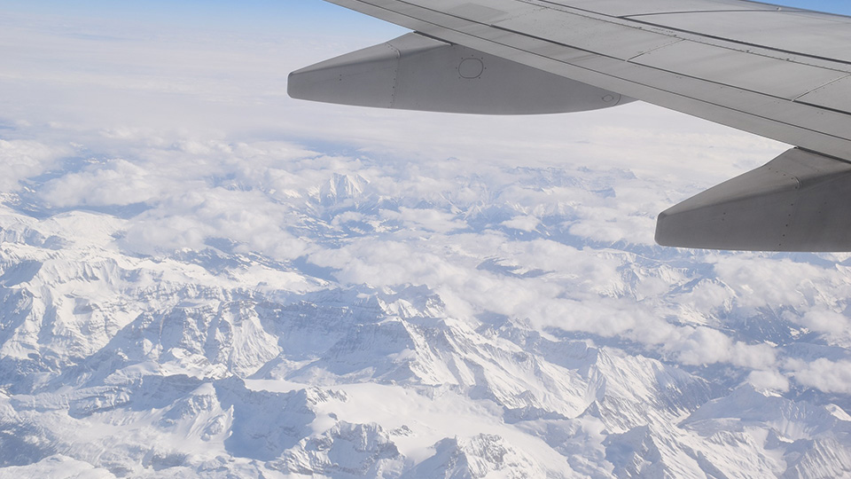 Plane flying over mountains