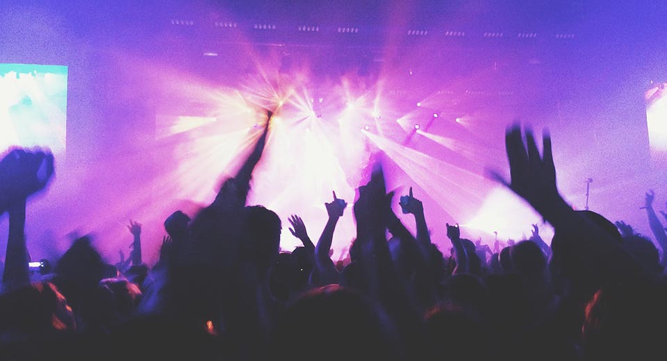 Concert with lights and hands in the air